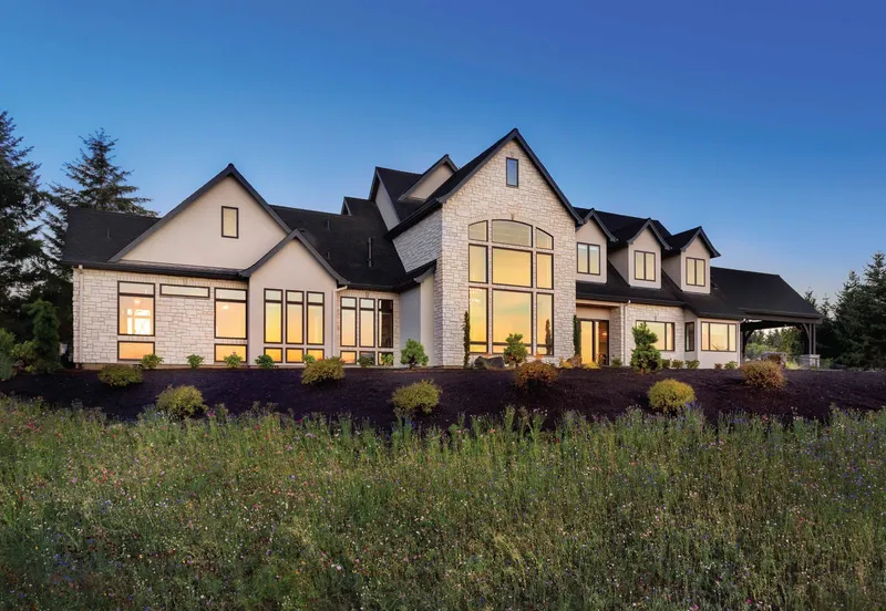 Replacement window installation in Sacramento — exterior of custom home with new windows